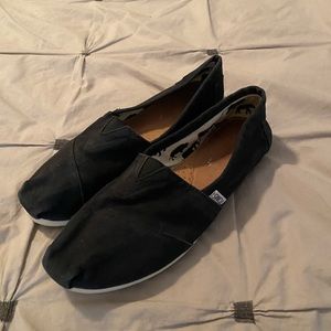 TOMS black slip-ons
